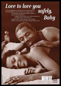 A_black_couple_lie_on_a_bed_together_smiling;_advertisement_Wellcome_L0052208